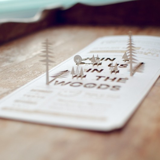 Laser-cut cover stock sewn to laser-cut kraft paper.